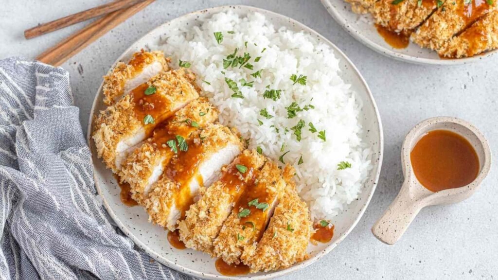 Air Fryer Chicken Katsu with Homemade Katsu Curry Sauce 22 Crispy air fryer chicken katsu sliced and served over steamed rice with homemade katsu curry sauce drizzled on top