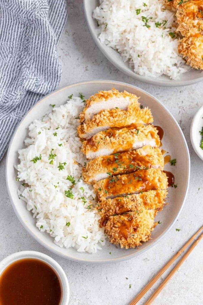Air Fryer Chicken Katsu with Homemade Katsu Curry Sauce 23 Crispy air fryer chicken katsu sliced and served over steamed rice with homemade katsu curry sauce drizzled on top