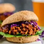 BBQ Lentil Sloppy Joes 21 BBQ lentil sloppy joes piled onto a toasted whole wheat bun with shredded red cabbage and sliced avocado