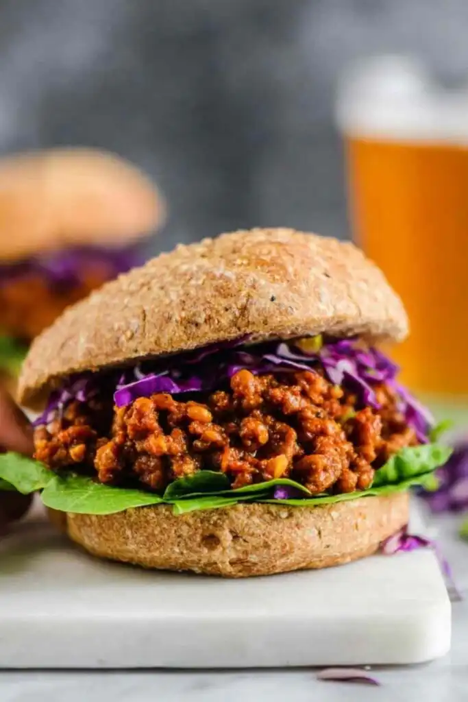 BBQ Lentil Sloppy Joes 20 BBQ lentil sloppy joes piled onto a toasted whole wheat bun with shredded red cabbage and sliced avocado