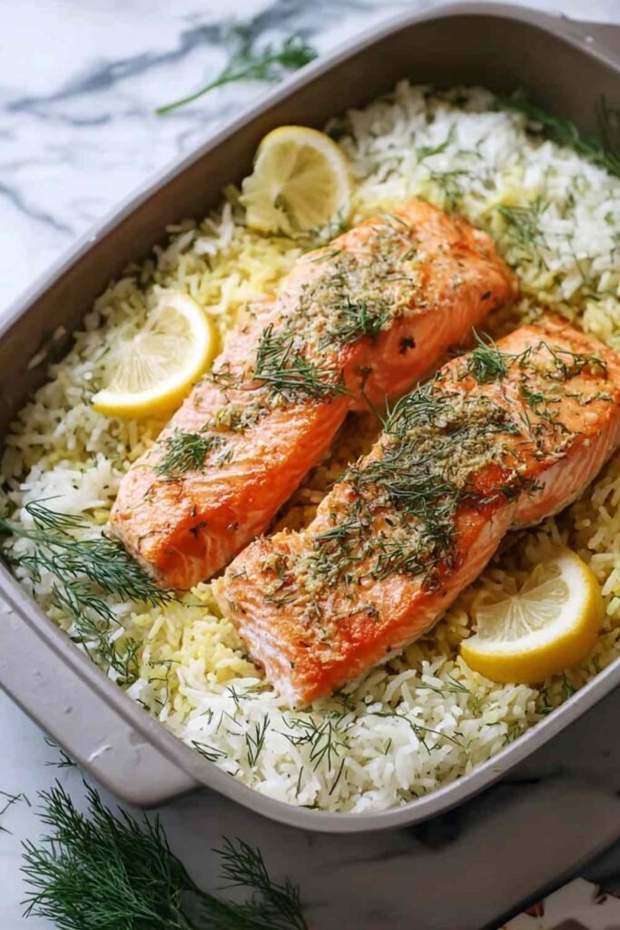 Baked Salmon and Dill Rice 17 Baked salmon and dill rice served in a large pan with fresh dill garnish and lemon wedges