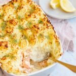 Best Ever Fish Pie 27 Golden best ever fish pie with cheesy mashed potato topping fresh out of the oven in a white ceramic baking dish