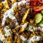Chicken Shawarma Bowl 18 Chicken Shawarma Bowl with shawarma-seasoned chicken served over fluffy white rice in a white bowl
