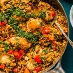 Chicken with Bulgur 6 Chicken with bulgur recipe served in a cast iron skillet topped with feta and fresh parsley
