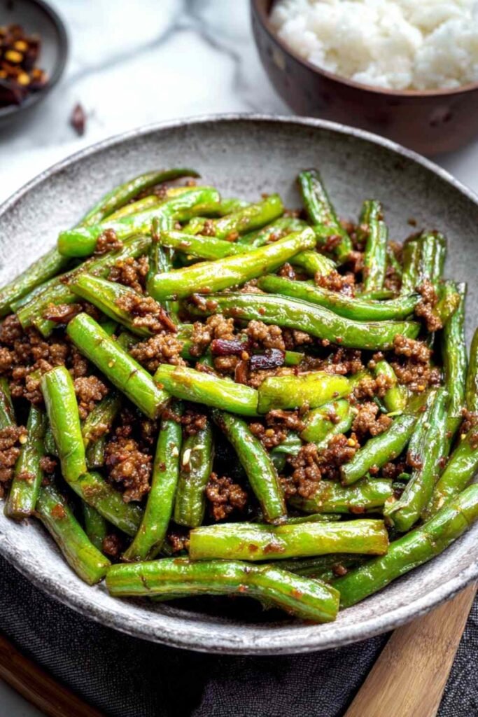 Chinese Green Beans and Ground Beef 11 Chinese green beans and ground beef stir-fry with blistered green beans and caramelized beef in a wok