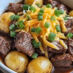 Crockpot Loaded Steak and Potato Bake 30 Crockpot Loaded Steak and Potato Bake with melted sharp cheddar and fresh chives served hot from the slow cooker