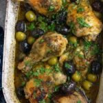 High Protein Chicken Marbella 21 High protein Chicken Marbella recipe served on a white platter with prunes, olives, capers, and fresh parsley garnish
