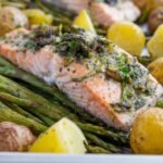 Easy salmon broccoli and potatoes on a sheet pan with asparagus and butter beans in a lemon-mustard marinade