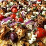 Greek Chicken Pita Pizza 18 Greek Chicken Pita Pizza topped with grilled chicken, crumbled feta, Kalamata olives, and cherry tomatoes fresh out of the oven
