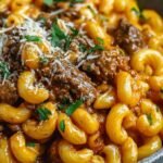 High-Protein Creamy Beef Pasta 12 High-protein creamy beef pasta served in a large skillet garnished with fresh parsley and parmesan