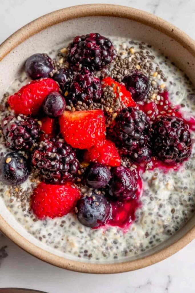 Overnight Oats with Mixed Berries 5 Mason jar of overnight oats with mixed berries topped with fresh strawberries, blueberries, and raspberries