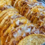 Spicy Baked Tacos 9 Spicy baked tacos in a 9x13 baking dish with melted cheese and crispy corn shells straight from a 400 degree oven