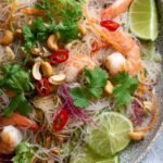 Yum Woon Sen (Thai Glass Noodle Salad) 3 Yum Woon Sen Thai glass noodle salad with wild prawns, pork, cashews, and fresh cilantro served in a large white dish