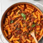 Creamy One Pot Ground Turkey Pasta with Veggies 18 Creamy one pot ground turkey pasta with veggies in a braiser pan topped with fresh basil and chili flakes