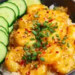 Bang Bang Shrimp 21 Crispy bang bang shrimp tossed in creamy sweet and spicy sauce served over steamed white rice with scallions