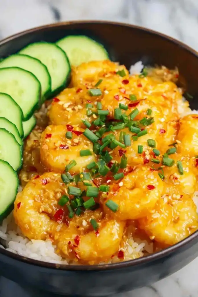 Bang Bang Shrimp 20 Crispy bang bang shrimp tossed in creamy sweet and spicy sauce served over steamed white rice with scallions
