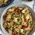 Mediterranean Chicken and Orzo 30 Mediterranean chicken and orzo with spinach and sundried tomatoes in a large skillet garnished with fresh parsley