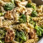 High Protein Rotisserie Chicken Broccoli Pasta 3 High protein rotisserie chicken broccoli pasta in a white bowl with creamy Parmesan sauce